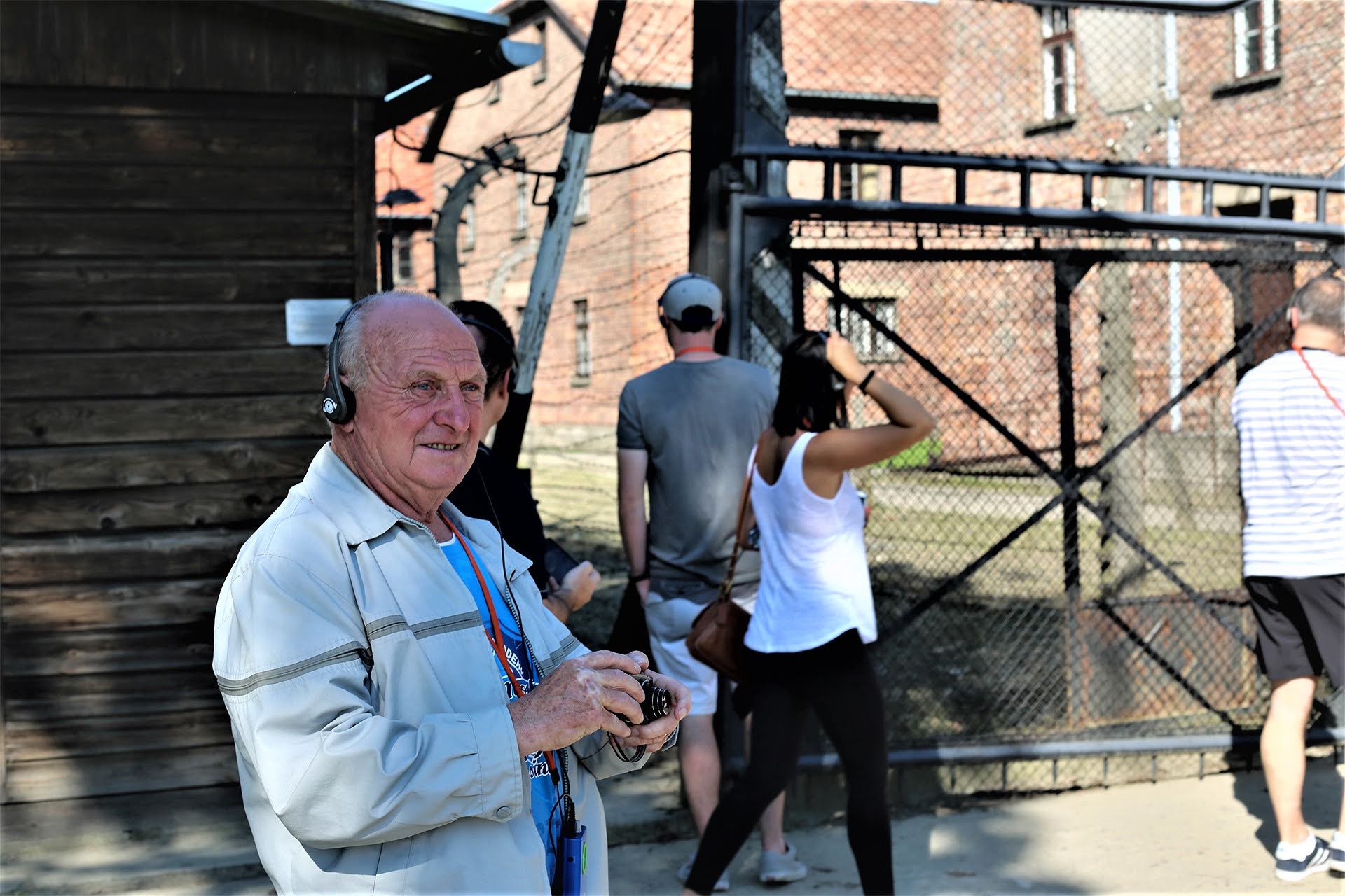 Visitor beside the electrified perimeter fence