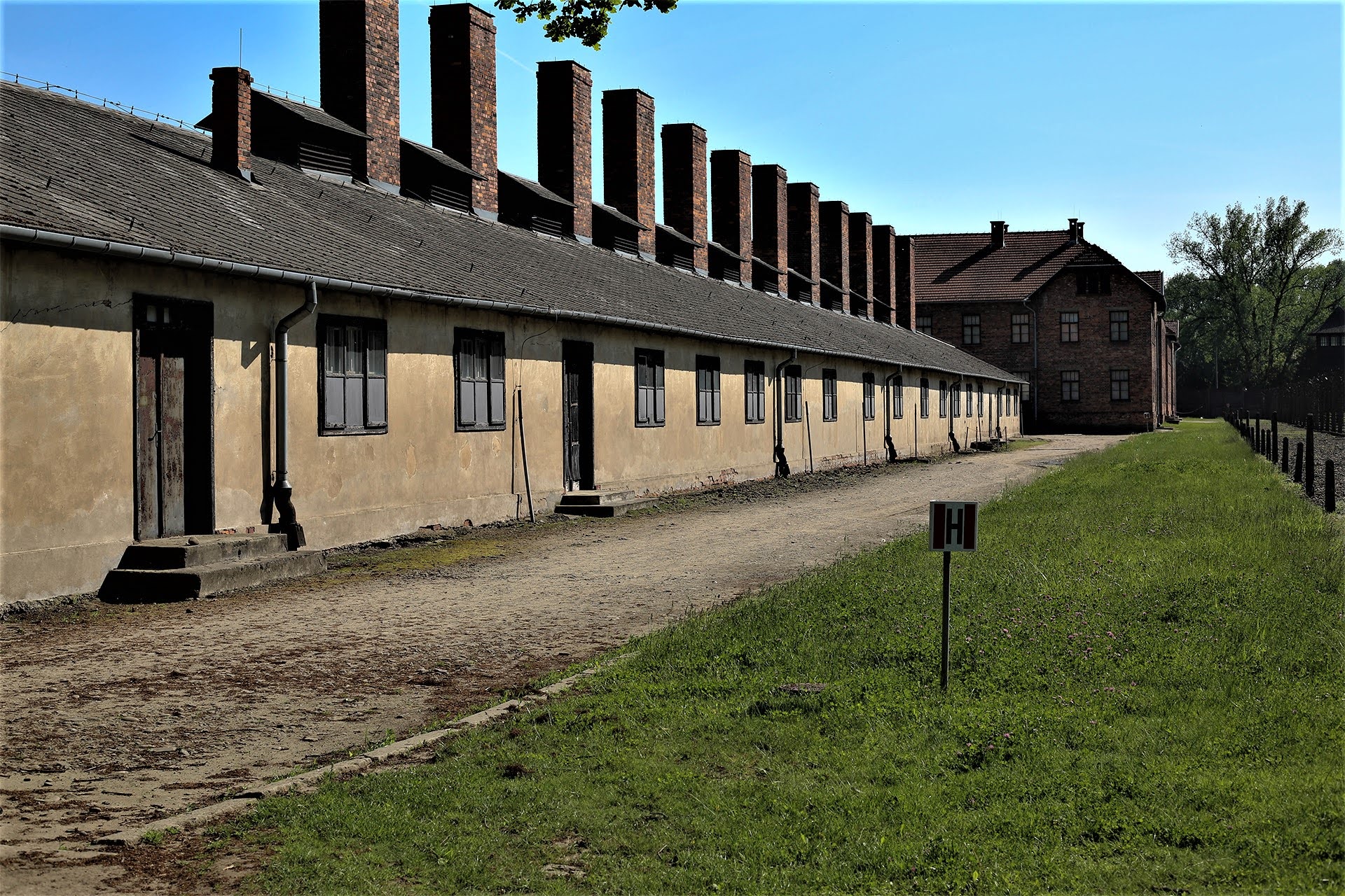 Row of barracks with tall chimneys at Auschwitz I